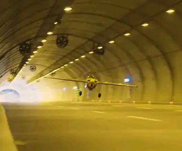 Stunt pilot sets Guinness World Record for longest flight through tunnel