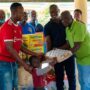 • Mr Kwabena Boakye Antwi (second from right) and other members of the association presenting the items to the children