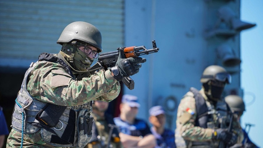 Romanian navy special forces take part in a shooting drill meant to consolidate Nato combat procedures (Image: AFP via Getty Images)