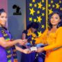 • Afia Agyakoma Bonsu (Left), Outstanding Youth Personality of the Year in a hand Shake with Mimi Owusu-Appiah