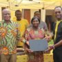 CEO Mr. Selorm Adadevoh (2nd Lft) presenting Laptops to officials of Asokwa MA Basic School as part of Yello Care Digital caravan