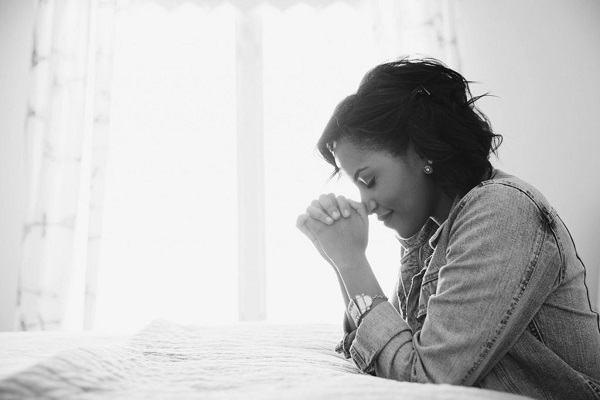 •A woman praying