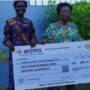 Reining Miss Tourism Ghana receives her monthly allowance cheque from Mrs.Delphine Brew-Hammond