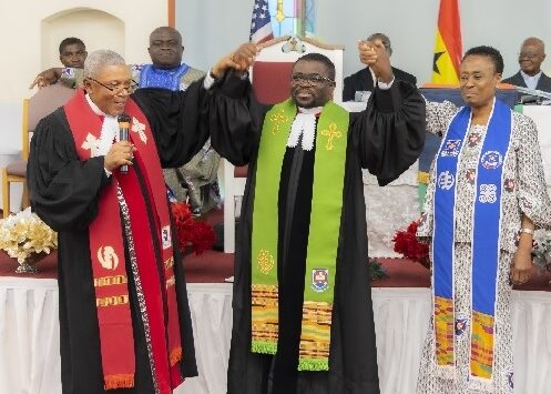 ) Rev Kumi-Duodu (left) and Prof Mrs Mabel Asante, First Clerk of the Presbytery, both raised Rev Dr. Awuku-Gyampoh's hands to introduce him to the congregation.