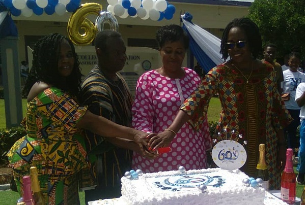 • Mrs Etwire (right) Pastor Dr Aloo( second from left) assisting Dr Cecilia Odame ( second from right) to cut the anniversary cake.
