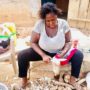 • Sharon busily processing some cassava