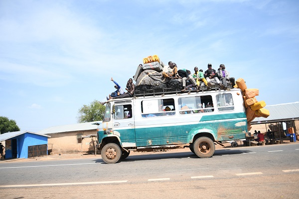 • Some passengers on rooftops of buses
