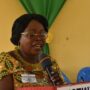 • Mrs. Mina Tweneboah-Kodua (inset) delivering her speech, A section of the head teachers