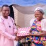 • Mrs. Mina Tweneboa-Kodua (right) receiving a gift from Mr. Abraham A. Aikins