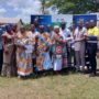 Mr Ofori presenting mosquito repellents to Nana Yaa Damoah