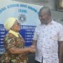 • Professor Ernest Uwazie (right) congratulating Ms. Justina Ativor on doing a good job.