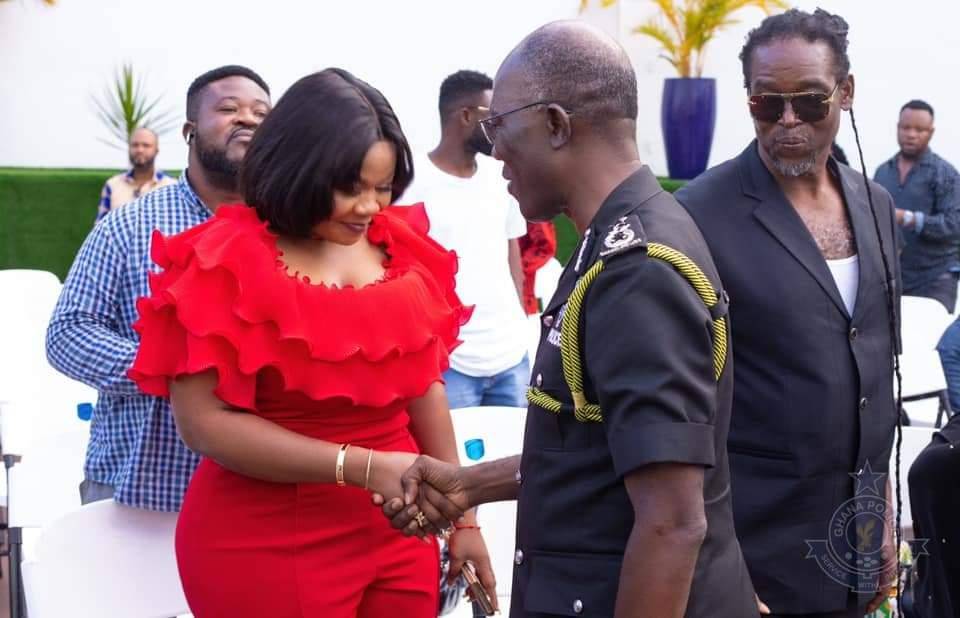 Empress Gifty in a handshake with IGP