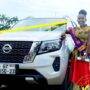 • Ms Wussah-Tetteh in a pose with the vehicle