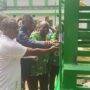 • Dr Enyan (middle, in blue) assisted by Mr Ofori-Siaw (left) jointly inaugurating the food elevator at St John’s kitchen