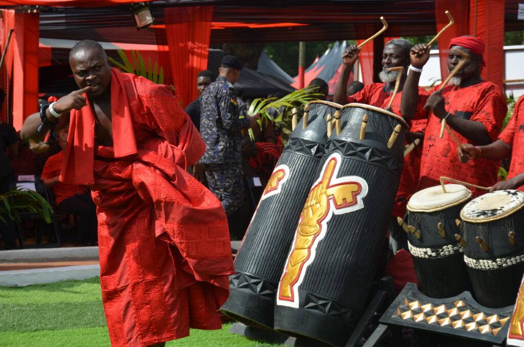 A mourner could not resist the melody from the drums