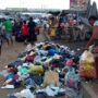 • A trader dumping refuse at the Madina Zongo Junction