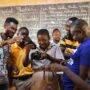 Mr Buta teaching the students to operate the camera