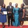 Dr Andy Osei Okrah with Mrs Ursula Owusu-Ekuful, (second from right), His wife, Alice and daughter Hilary (right) after the award.