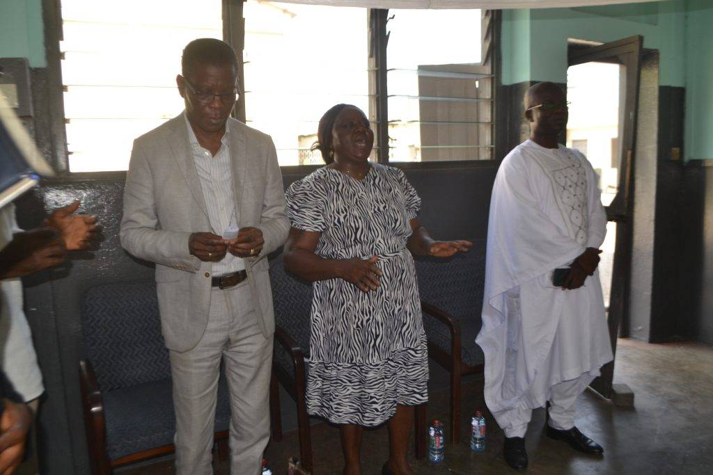 • Mrs Quaittoo the of the Spectator
[middle] singing at the church service
with Mr Agbenu [left] Times and Mr.
Suleman Osman