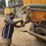 • Godfred Abayateye inspecting a truck after collecting human waste to ensure there is no spillage