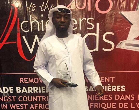 Ambassador Amadu with one of his awards